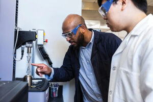 researcher with protective glasses in a lab space