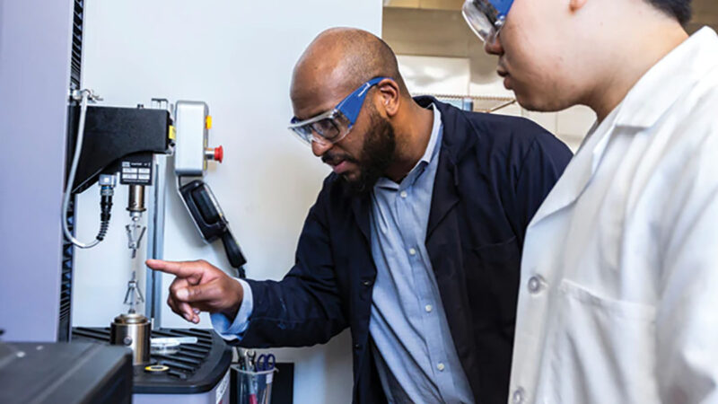 researcher with protective glasses in a lab space