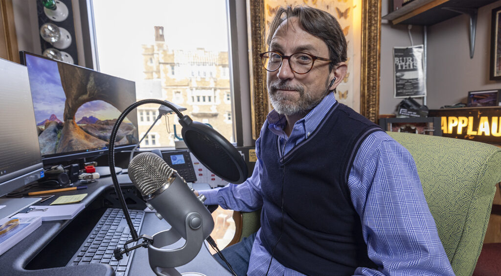 Robert Mark Morgan in his office podcast studio. (Photo: Joe Angeles/WashU)