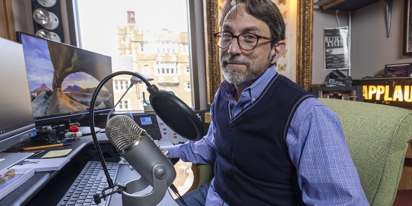 Robert Mark Morgan in his office podcast studio. (Photo: Joe Angeles/WashU)