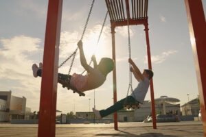 kids swinging at a playground