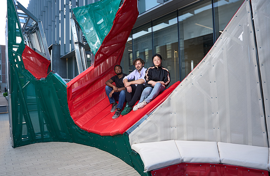 Scott Mitchell (center) with students Josiah Gooden (left) and Lenora Li (right) and the architectural structure they built in Mitchell's course "Intelligent Prefabrication." (Photo: Theo R. Welling/WashU)